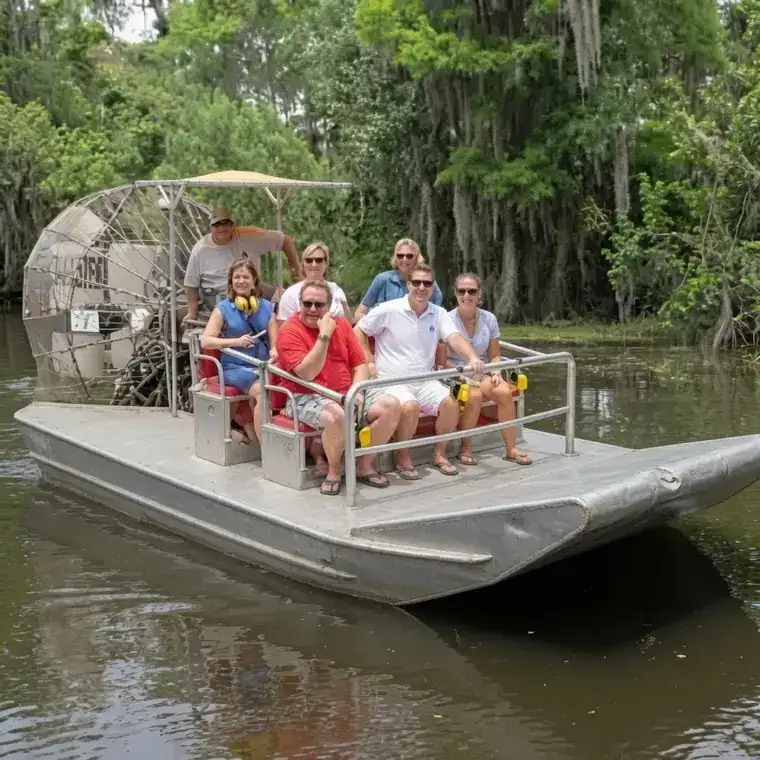 Guests riding a small airboat through Louisiana wetlands